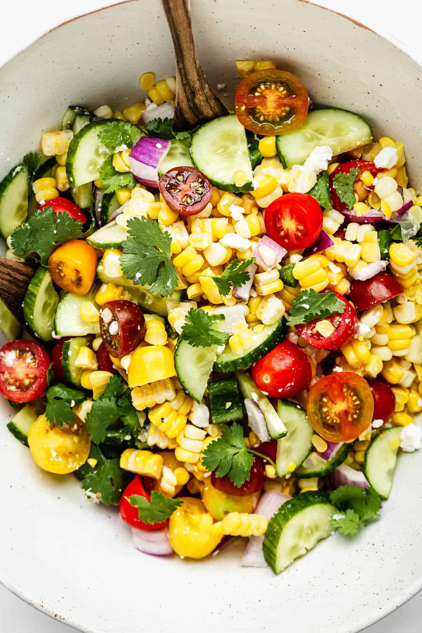 Summer corn salad in a large white bowl
