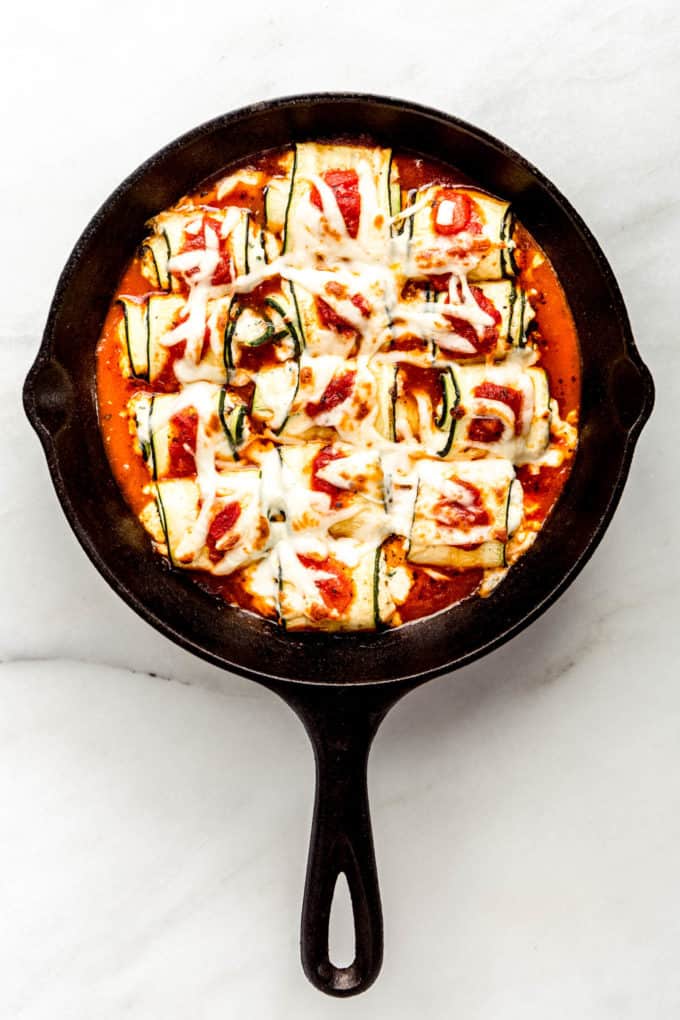 Zucchini roll ups in a cast iron skillet