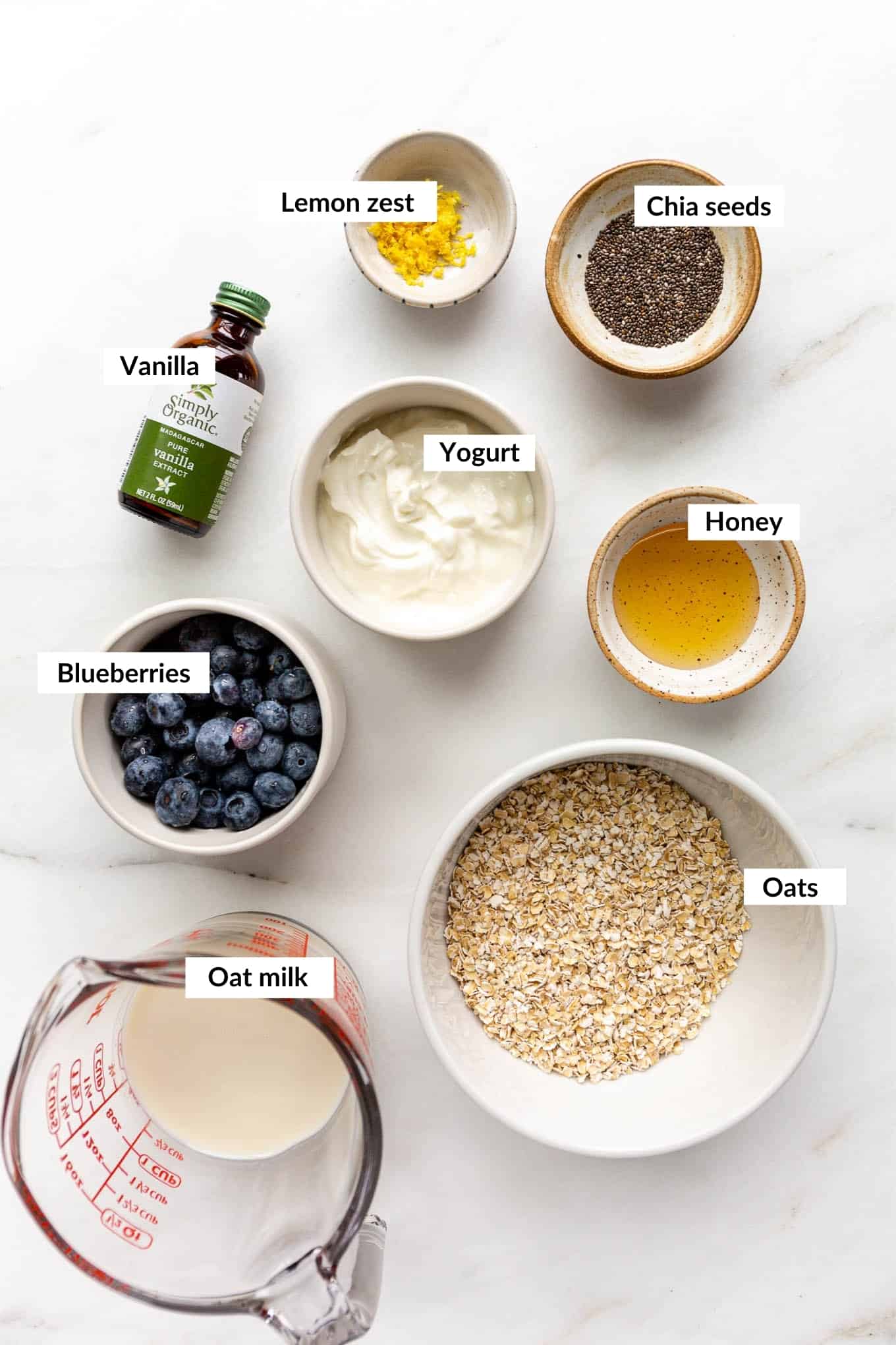 A flat lay of ingredients to make blueberry overnight oats