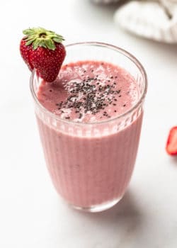 A strawberry chia seed smoothie in a glass