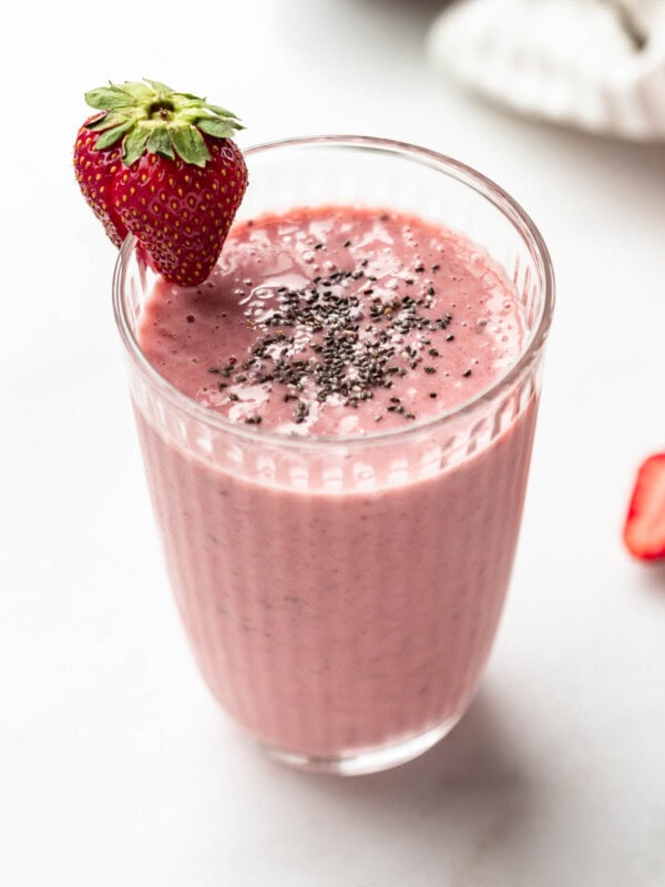 A strawberry chia seed smoothie in a glass