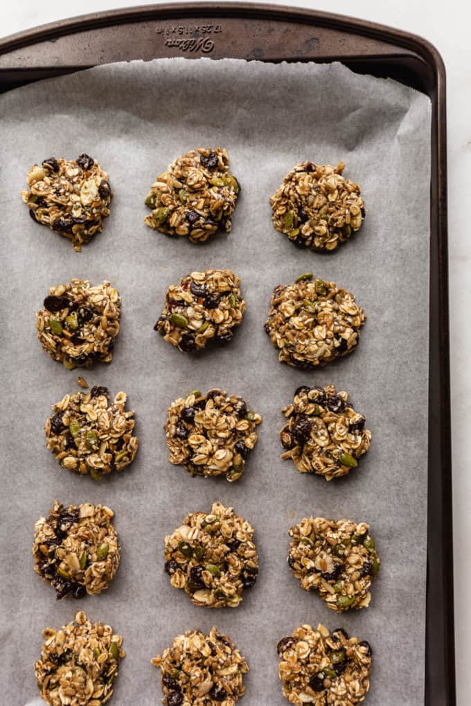 a baking sheet with unbaked cookies on it