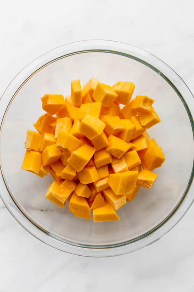 cubes of pumpkin in a clear mixing bowl