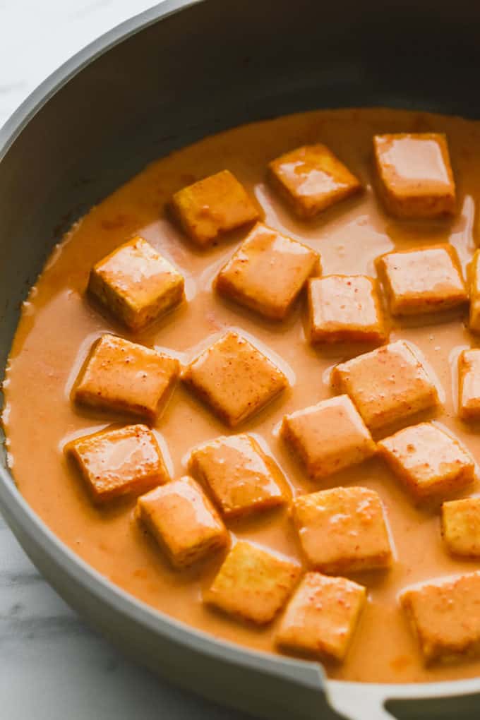 a close up of cubed tofu in a pan