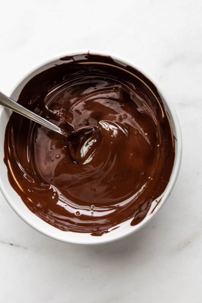 a bowl of melted dark chocolate