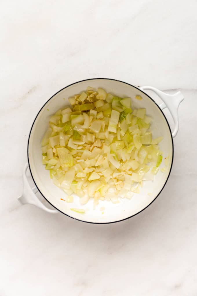 onions and garlic in a white pot