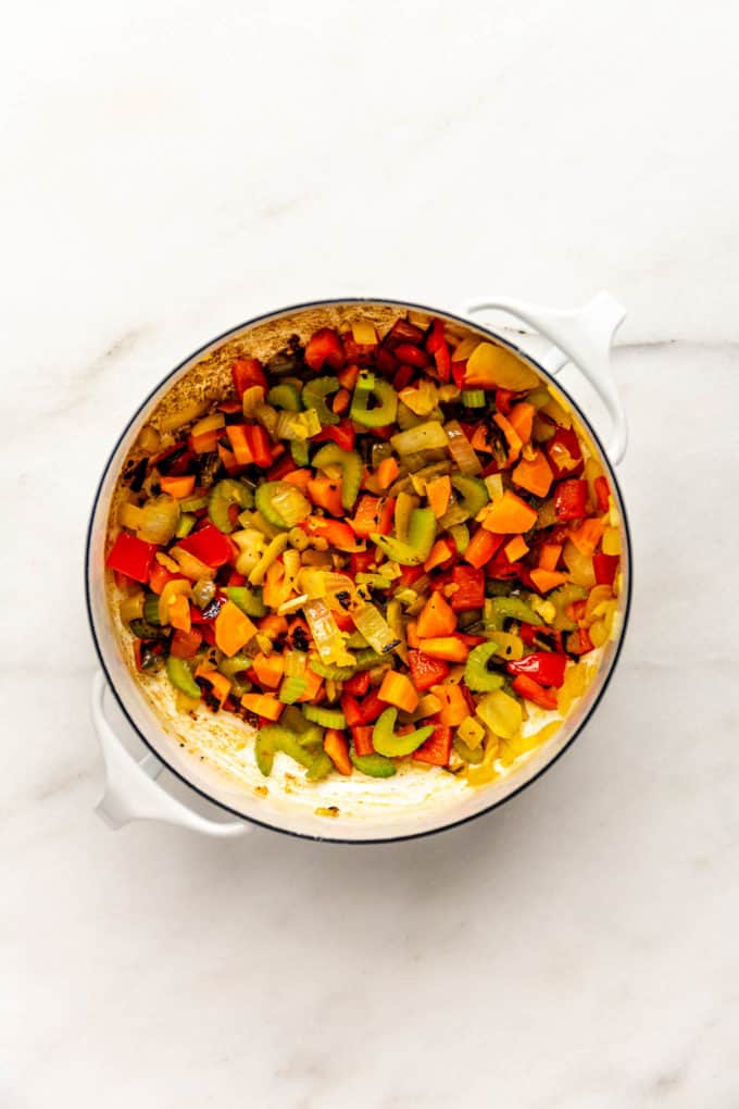 sauteed vegetables in a white pot