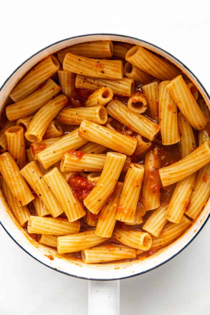 ziti noodles in tomato sauce in a white pot