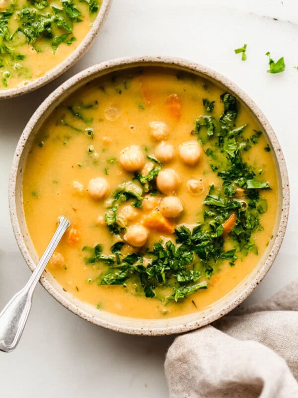 Chickpea soup in a bowl topped with parsley