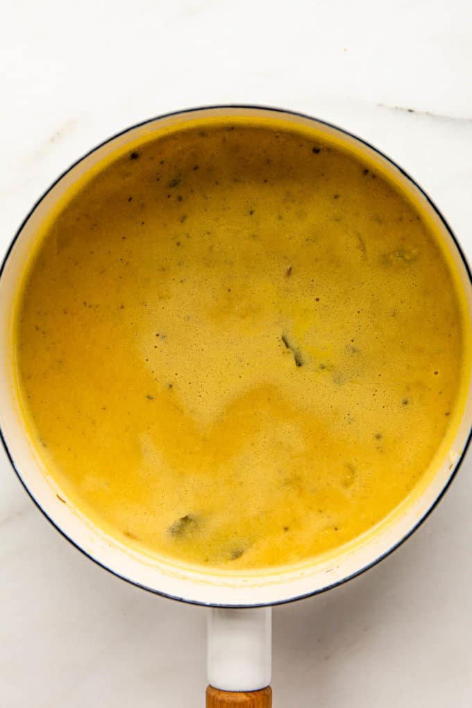 Chickpea soup broth in a white pot