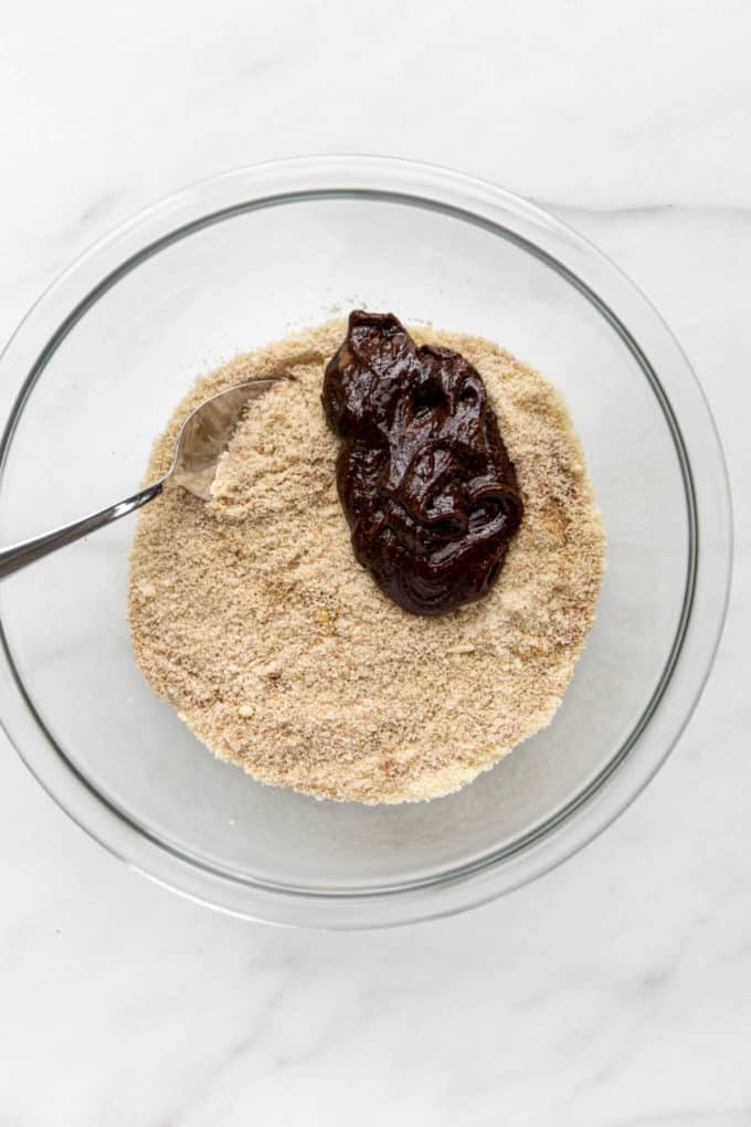 almond flour and molasses in a clear mixing bowl