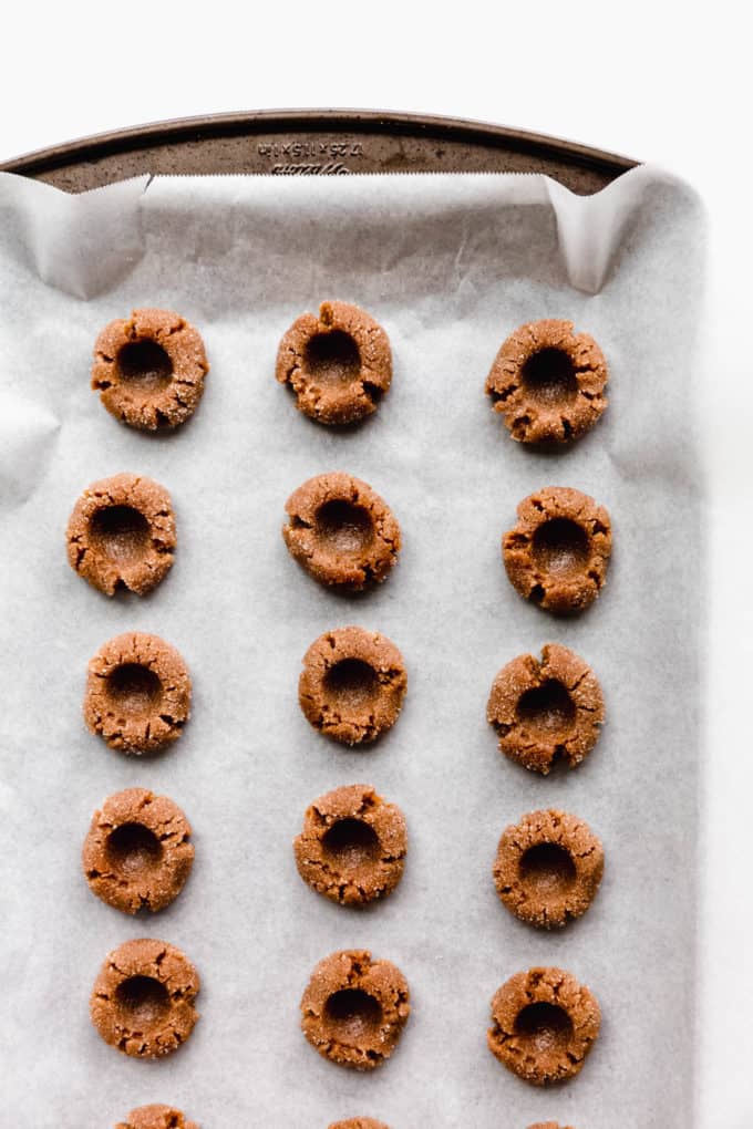 unbaked peanut butter cookies on a baking sheet
