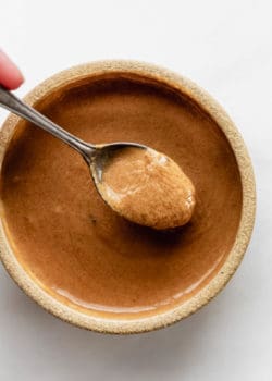 A spoon of Thai peanut sauce