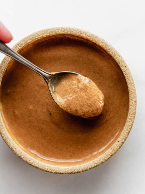 A spoon of Thai peanut sauce
