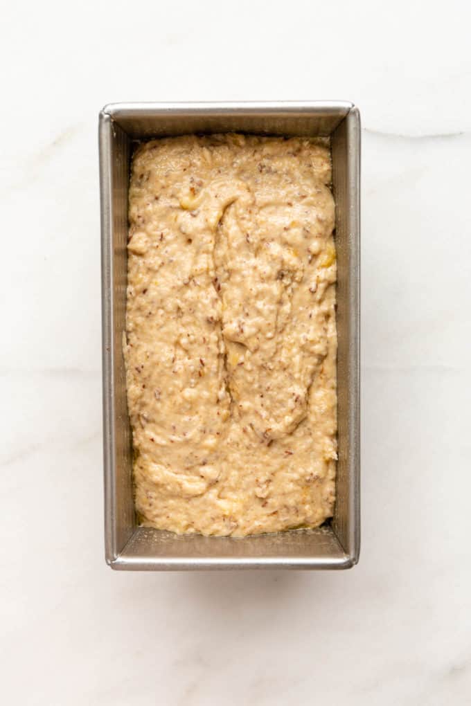vegan banana bread bater in a loaf pan