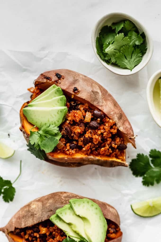 stuffed sweet potatoes with quinoa, beans, avocado and cilantro
