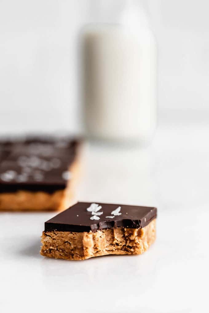 a peanut butter protein bar with a bite taken out of it