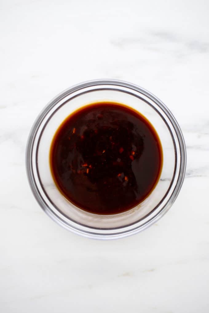 a dipping bowl with sesame sauce in it