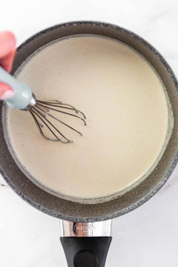 cashew milk with flour and vegan butter in a pot