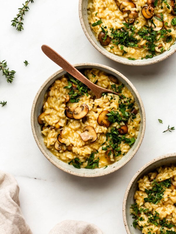 three bowls of vegan mushroom risotto