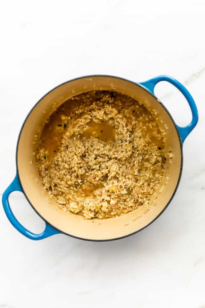risotto with vegetable broth in a pot