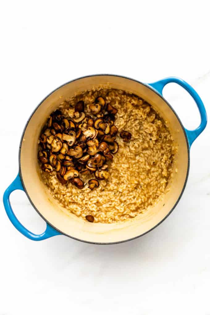 risotto and sautéed mushrooms in a pot
