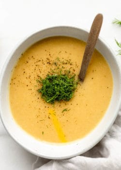 vegan potato soup in a bowl topped with dill