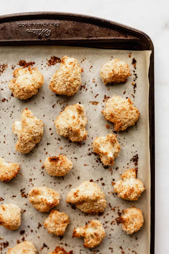 Baked panko crusted cauliflower on a baking sheet
