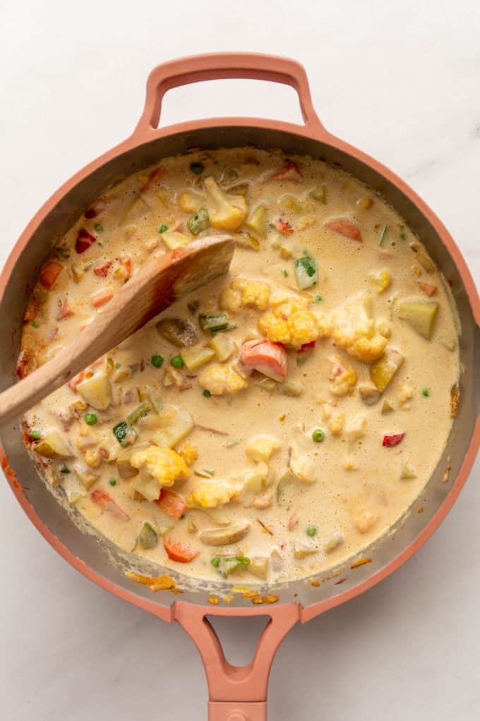 vegetables and cashew cream in a pan