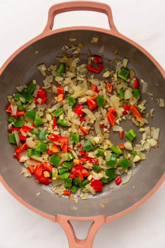 Sauteéd peppers and onions in a pan