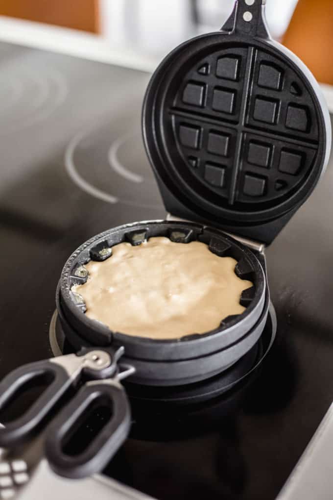 Waffle batter in a waffle press