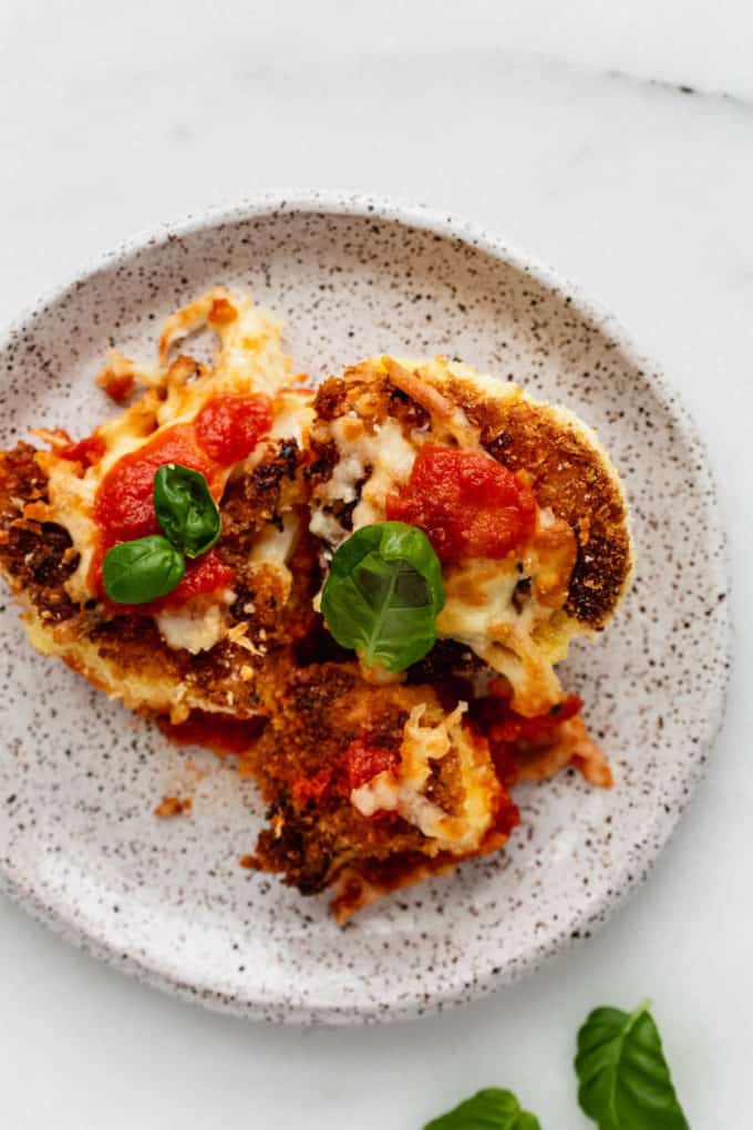 cauliflower parmesan on a white speckled plate