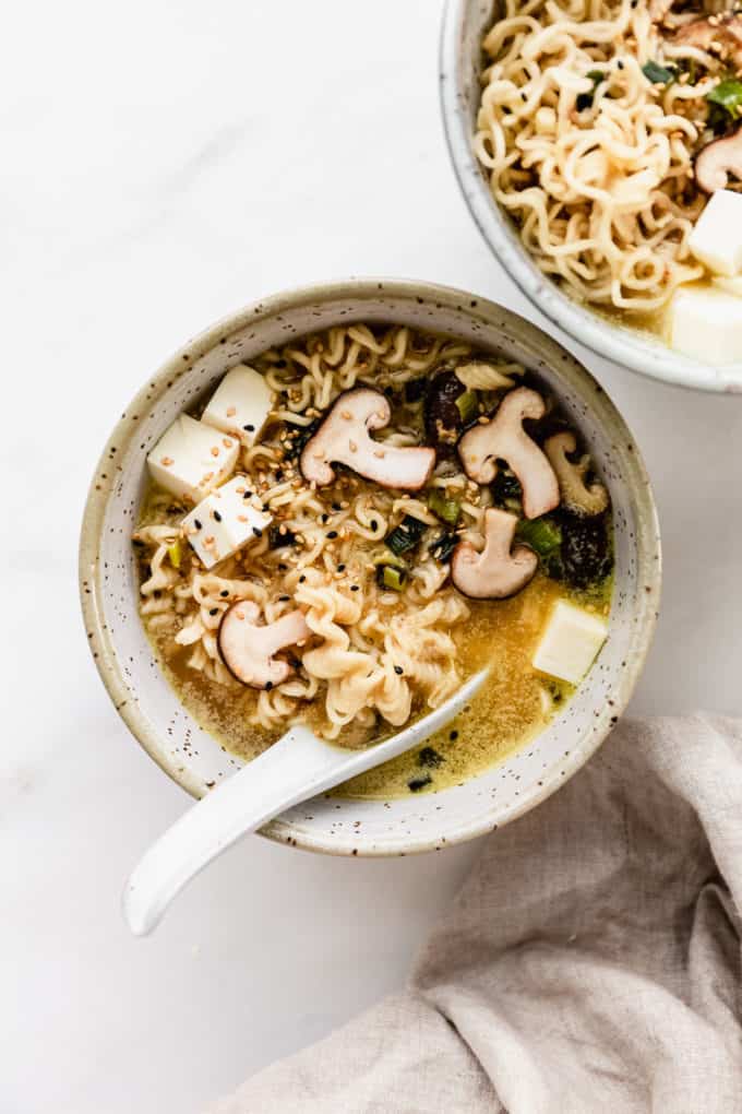 A bowl of miso ramen with amen noodles and shitake mushrooms