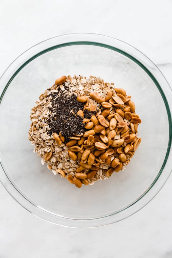 peanuts, chia seeds and oats in a mixing bowl