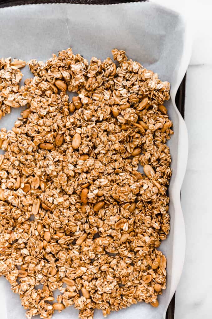 unbaked peanut butter granola on a baking sheet
