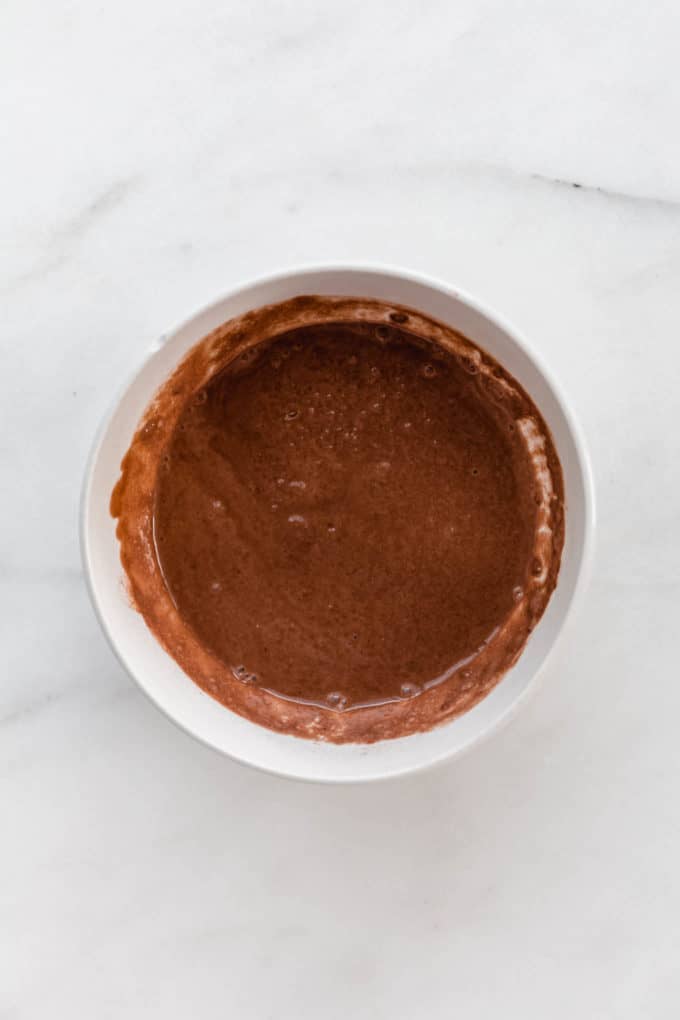 chocolate coconut milk with chia seeds in a bowl
