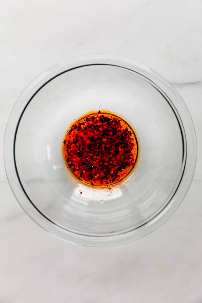 Asian dressing in a clear mixing bowl