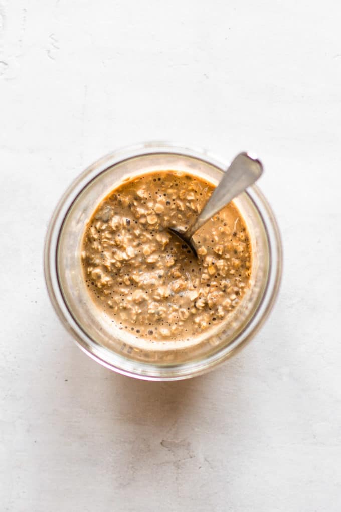 oats, milk and coffee in a cup with a spoon