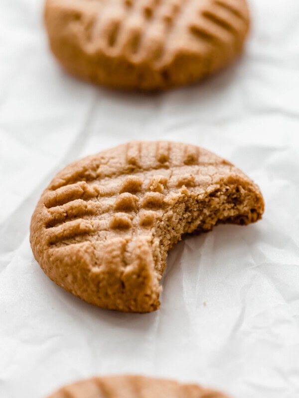 a peanut butter cookie with a bite taken out of it