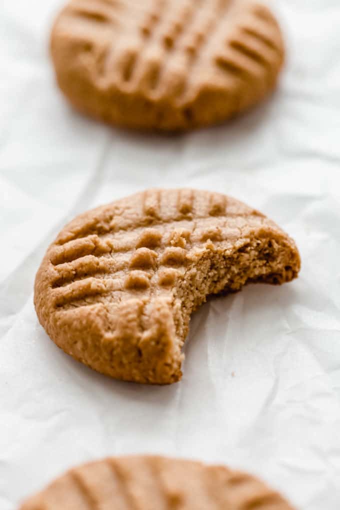 a peanut butter cookie with a bite taken out of it