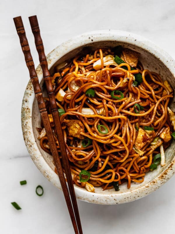 A bowl of mie goreng noodles with chopsticks