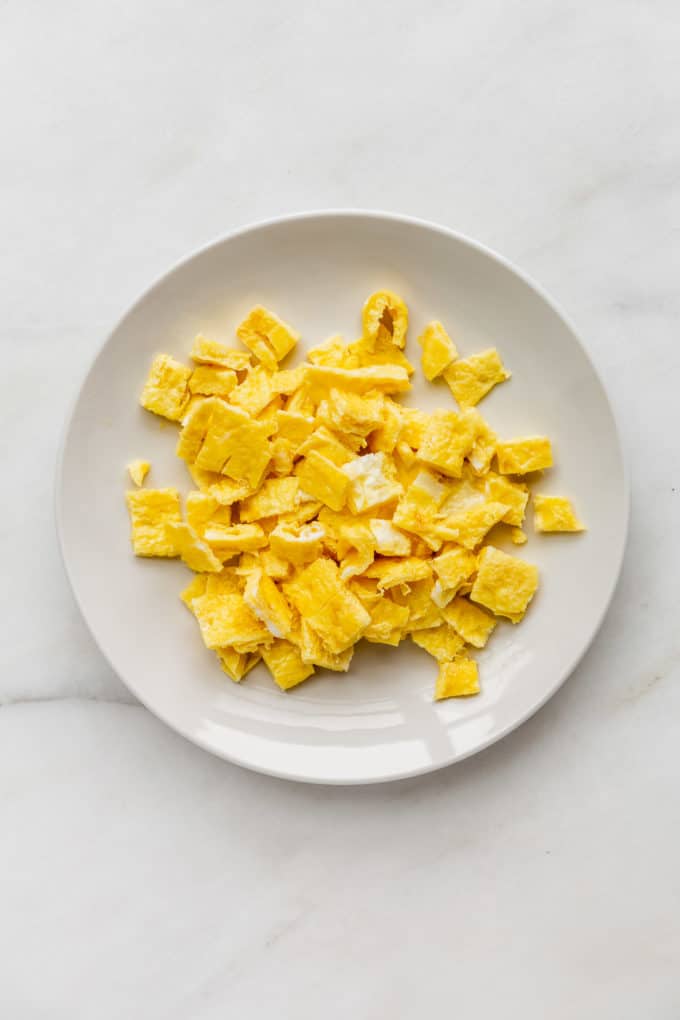 chopped up omelette on a white plate