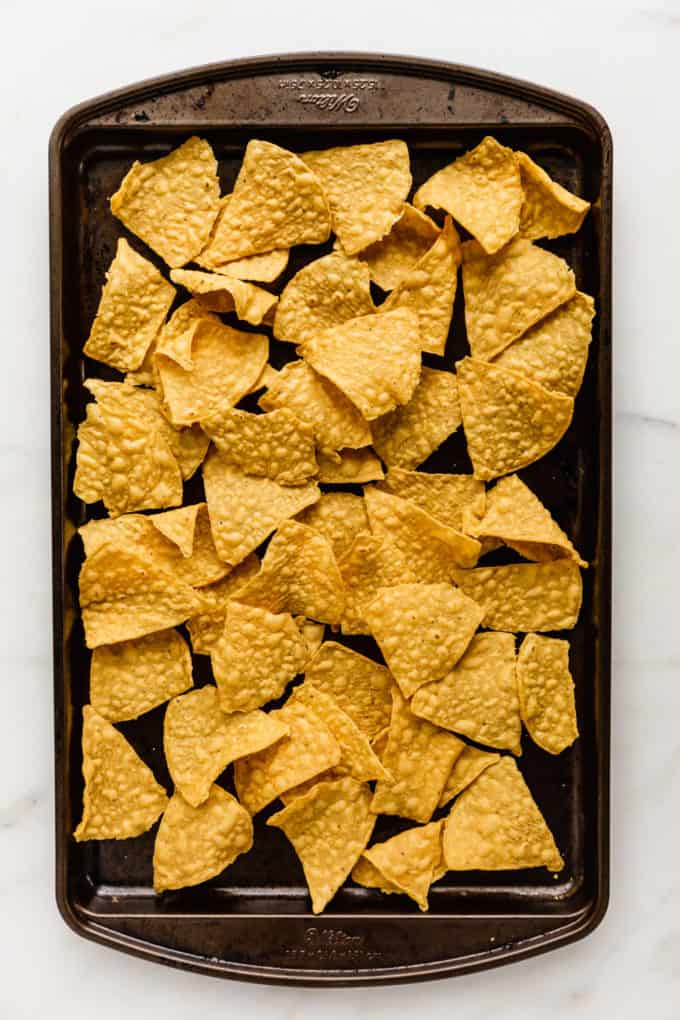tortilla chips on a baking sheet