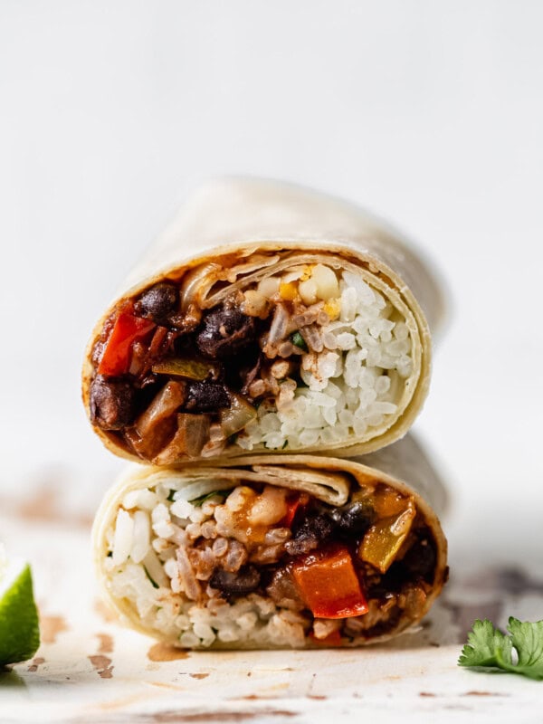 two veggie burritos stacked on top of each other