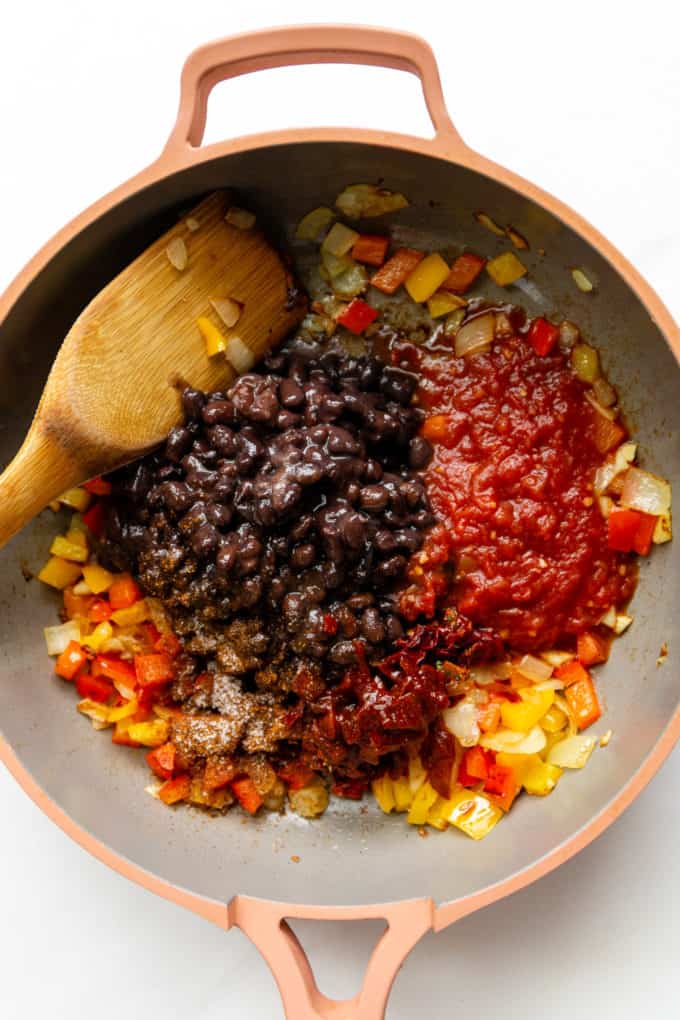 beans, salsa, peppers and chipotle in a pink pan