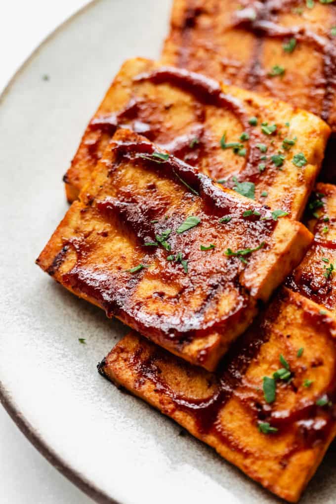 a close up of a piece of barbecue tofu