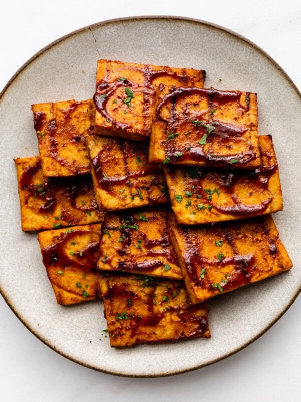 A plate of barbecue tofu cut into squares