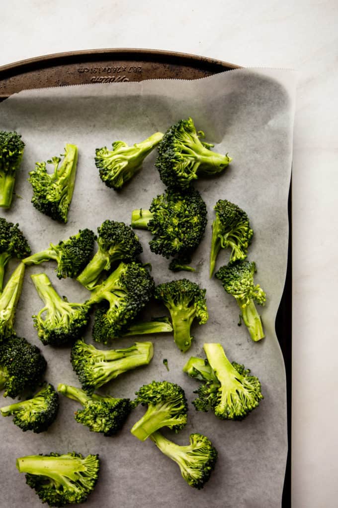 broccoli florets on a baking sheet