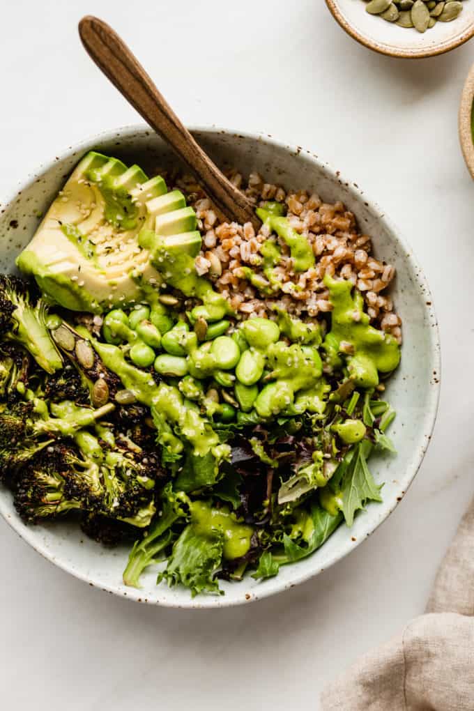 green goddess bowl with broccoli, edamame and avocado