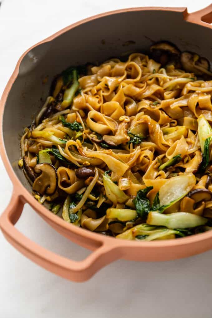 a pan of stir-fried ho fun noodles